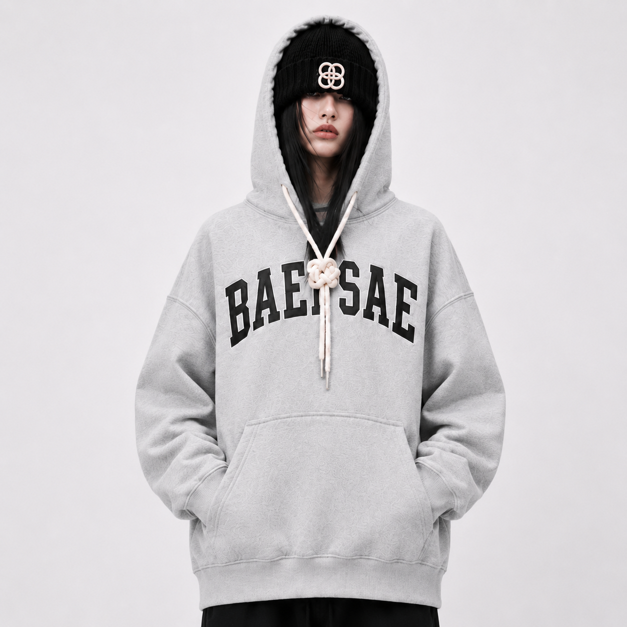 Close-up of BAEPSAE grey varsity hoodie with premium rope drawstring detail