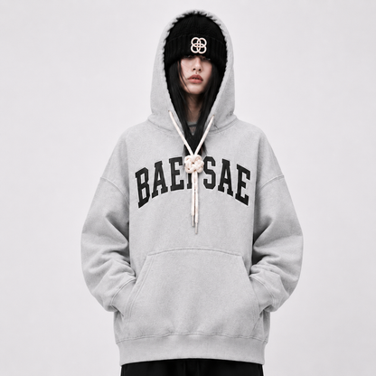 Close-up of BAEPSAE grey varsity hoodie with premium rope drawstring detail