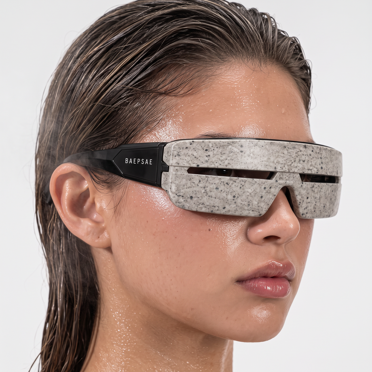 Model wearing BAEPSAE VEIL 01 futuristic shield sunglasses, three-quarter view